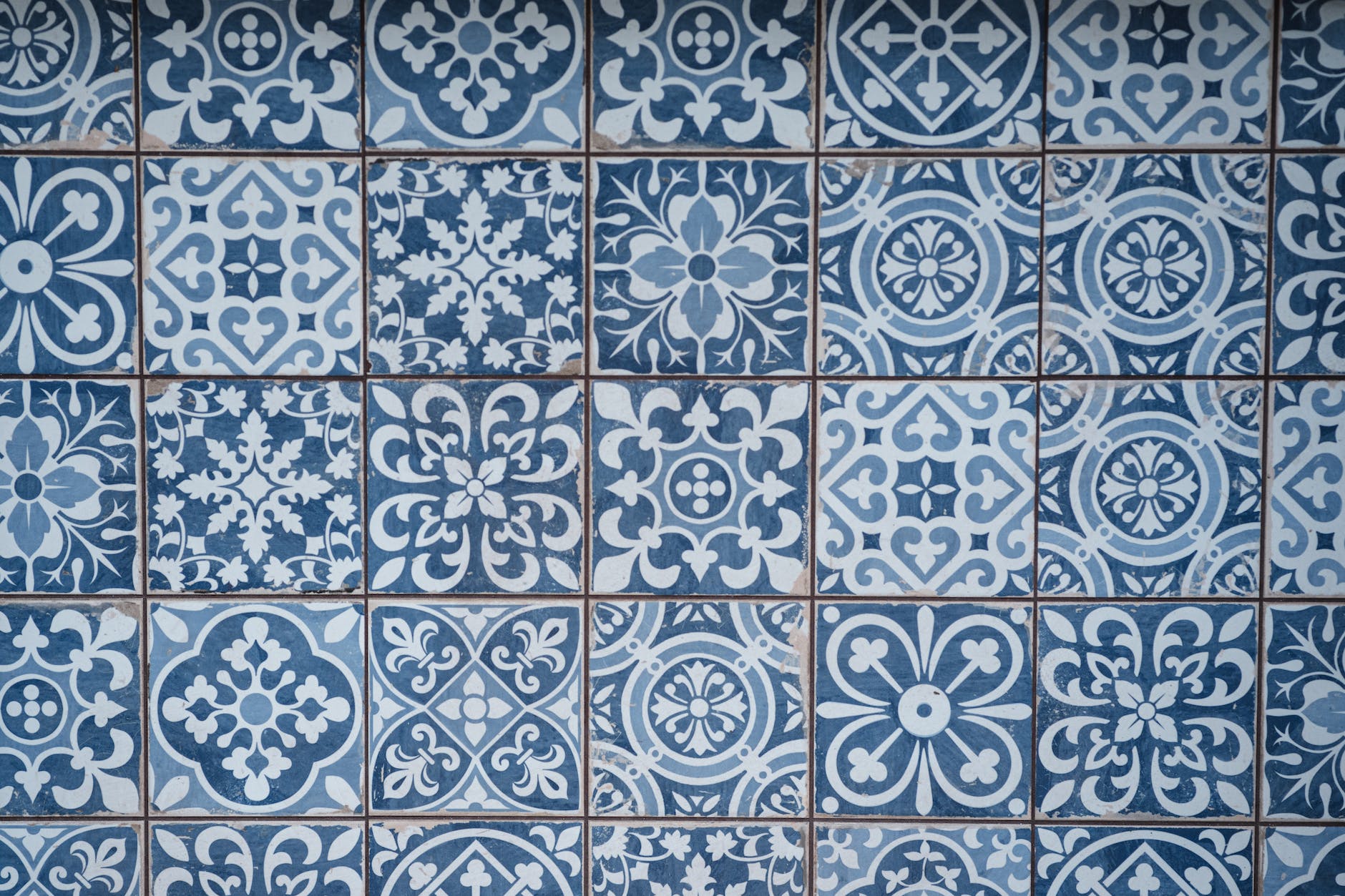 blue tile patterns in repeating arrangement