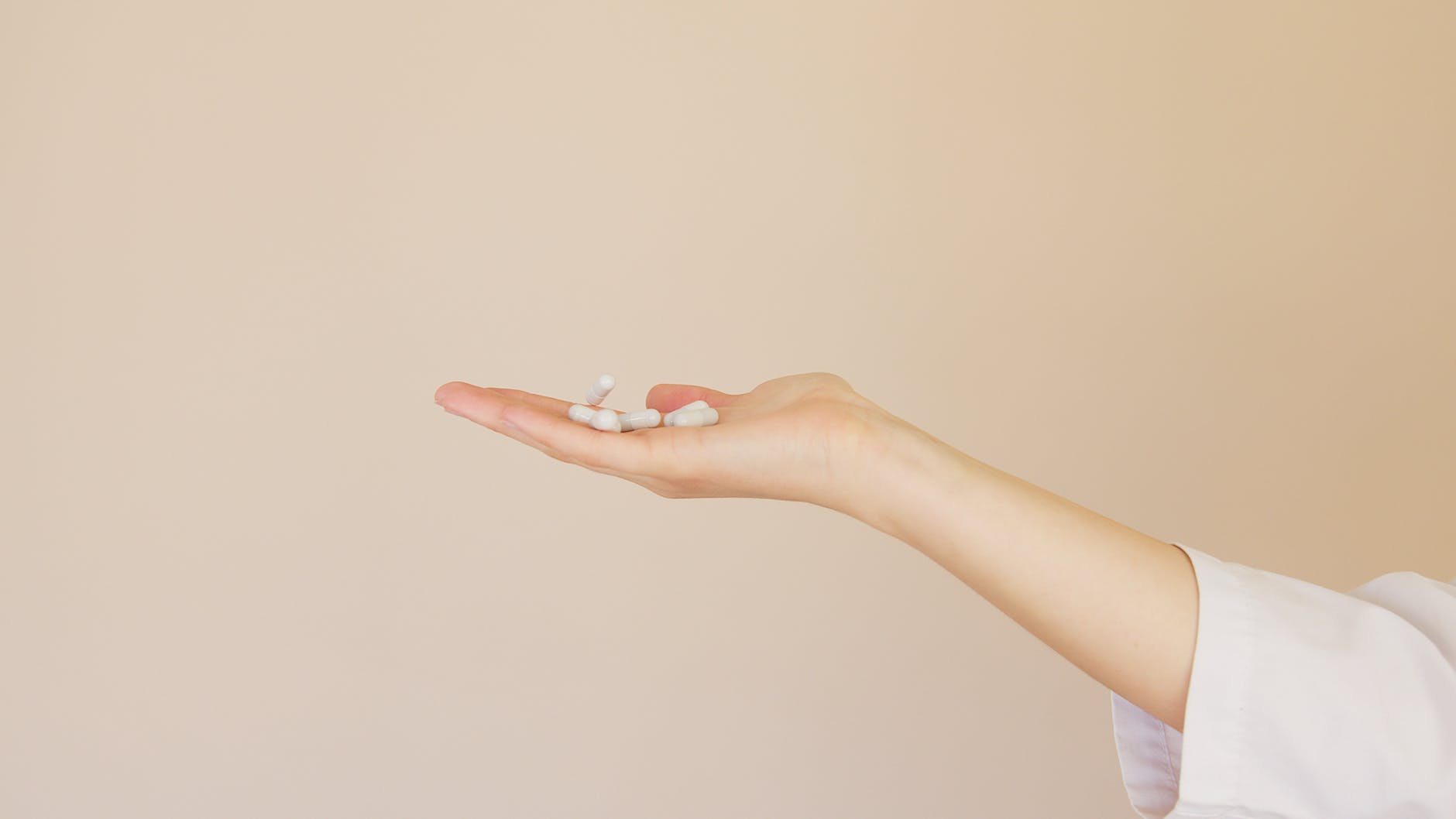 open palm handing pill
