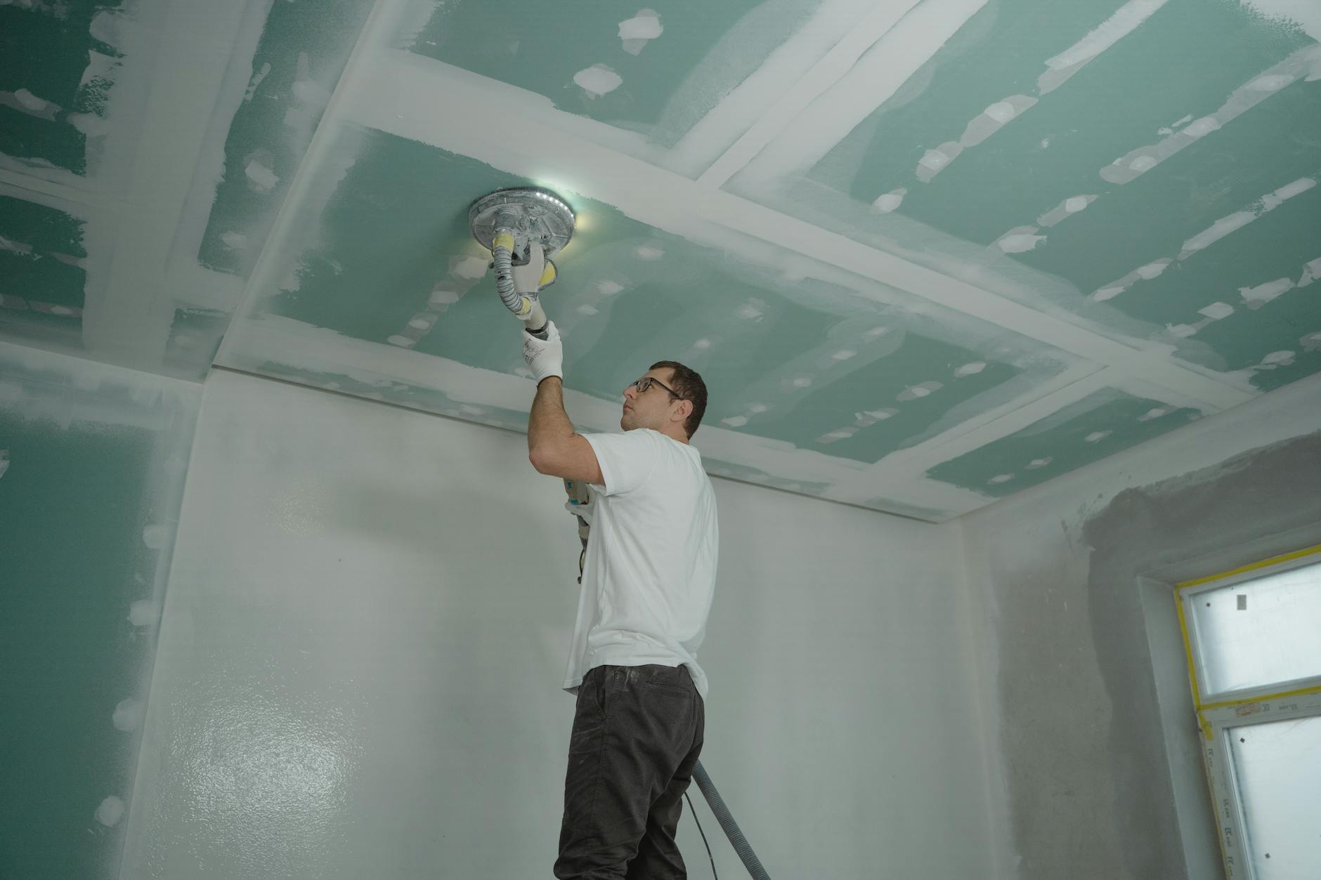 person polishing ceiling